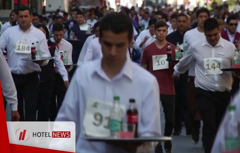 Waiters participates in race by carrying a tray of drinks in the city of Buenos Aires